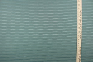 This duotone striped jacquard fabric in dark seafoam green is durable and hard wearing with a rating of 30,000 double rubs.  It can be used for multi purpose upholstery, bedding, accent pillows and drapery.  