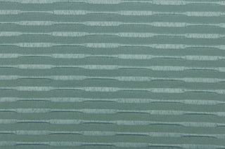 This duotone striped jacquard fabric in dark seafoam green is durable and hard wearing with a rating of 30,000 double rubs.  It can be used for multi purpose upholstery, bedding, accent pillows and drapery.  