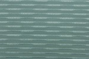 This duotone striped jacquard fabric in dark seafoam green is durable and hard wearing with a rating of 30,000 double rubs.  It can be used for multi purpose upholstery, bedding, accent pillows and drapery.  