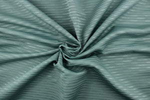 This duotone striped jacquard fabric in dark seafoam green is durable and hard wearing with a rating of 30,000 double rubs.  It can be used for multi purpose upholstery, bedding, accent pillows and drapery.  