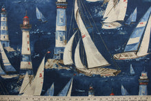 Load image into Gallery viewer, In the Breeze, a 100% cotton duck fabric featuring cheerful designs of sail boats and light houses. With 15,000 double rubs of strength and colorfastness, this luxurious indigo, brown, light blue, red, and tan material will last and look great for years to come. The versatile fabric is perfect for window accents (draperies, valances, curtains and swags) cornice boards, accent pillows, bedding, headboards, cushions, ottomans, slipcovers and light duty upholstery.  
