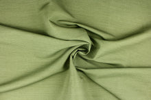 Load image into Gallery viewer,  This fabric features duo tone stripes in pesto green.  It offers beautiful design, style and color to any space in your home.  It has a soft workable feel and is perfect for window treatments (draperies, valances, curtains, and swags), bed skirts, duvet covers, light upholstery, pillow shams and accent pillows.  
