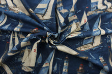 Load image into Gallery viewer, In the Breeze, a 100% cotton duck fabric featuring cheerful designs of sail boats and light houses. With 15,000 double rubs of strength and colorfastness, this luxurious indigo, brown, light blue, red, and tan material will last and look great for years to come. The versatile fabric is perfect for window accents (draperies, valances, curtains and swags) cornice boards, accent pillows, bedding, headboards, cushions, ottomans, slipcovers and light duty upholstery.  
