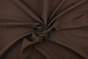 Session is a textured duo tone fabric in brown.  It is clean and crisp and would work well for draperies, curtains, cornice boards, pillows, cushions, bedding, headboards and other craft projects.