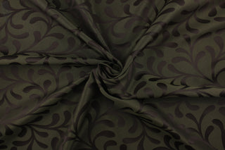 Havelock features a leaf scroll design in dark brown and deep green.  A slight sheen enhances the design.  This fabric offers beautiful design, style and color to any space in your home.  It has a soft workable feel and is perfect for window treatments (draperies, valances, curtains, and swags), bed skirts, duvet covers, pillow shams and accent pillows.  