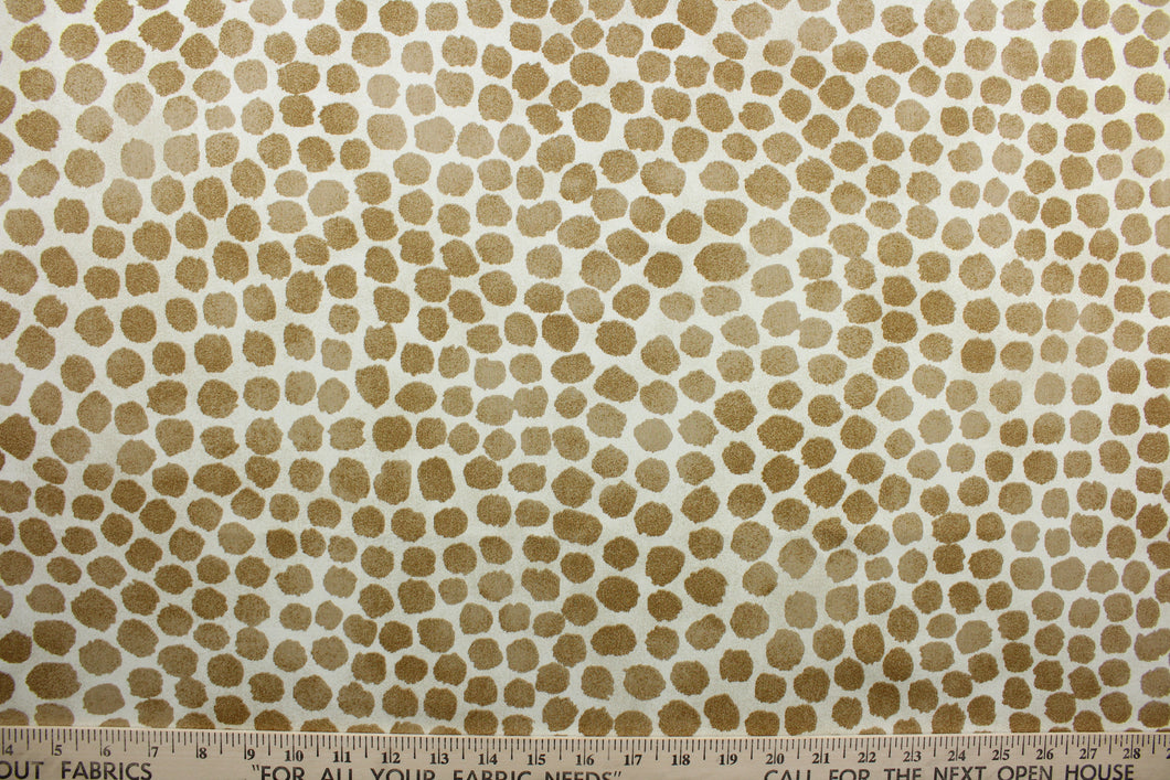 Puff Dotty is an indoor-and-outdoor upholstery fabric with a soil-and-stain repellant finish.  It features golden brown dots on a cream background, screen printed for lasting quality and beauty.  With 51,000 double rubs, it stands up to frequent use, making it great for throw pillows, chair cushions, table top accessories, tote bags, and more.