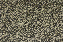 Load image into Gallery viewer, This fabric features a circular pattern in onyx and gold.  It offers beautiful design, style and color to any space in your home.  It has a soft workable feel and is perfect for window treatments (draperies, valances, curtains, and swags), bed skirts, duvet covers, pillow shams and accent pillows.  
