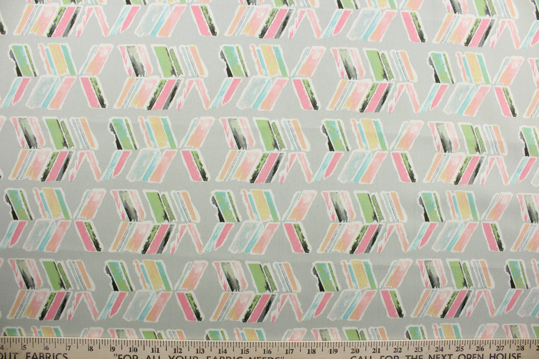 Spring In To Action features abstract arrows in colorful shades of pink, blue, green, white and yellow against a gray background. Its 51,000 double rubs ensures its durability and resilience.  Perfect for window accents (draperies, valances, curtains and swags) cornice boards, accent pillows, bedding, headboards, cushions, ottomans, slipcovers and light duty upholstery.  