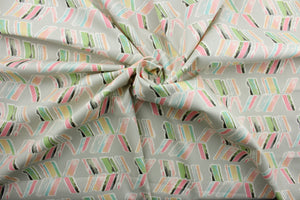 Spring In To Action features abstract arrows in colorful shades of pink, blue, green, white and yellow against a gray background. Its 51,000 double rubs ensures its durability and resilience.  Perfect for window accents (draperies, valances, curtains and swags) cornice boards, accent pillows, bedding, headboards, cushions, ottomans, slipcovers and light duty upholstery.  
