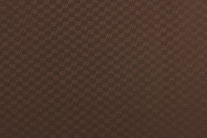  Roker is a textured brown fabric with a slight sheen which enhances the design.  It offers beautiful design, style and color to any space in your home.  It has a soft workable feel and is perfect for window treatments (draperies, valances, curtains, and swags), light upholstery,  bed skirts, duvet covers, pillow shams and accent pillows.  