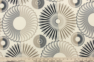 This screen printed fabric features decorative circles in brown and black on a cream background.  It can be used for several different statement projects including window accents (drapery, curtains and swags), toss pillows, bed skirts, light duty upholstery, handbags and duvet covers. It has a soft workable feel yet is stable and durable.  