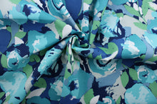 Load image into Gallery viewer, Novino is the perfect fabric for outdoor living.  Featuring painterly blooms in shades of blue, green, grey and white, it&#39;s constructed from a UV fade resistant, mildew, water and stain resistant fabric.  Perfect for porches, patios and pool side.  Uses include toss pillows, cushions, upholstery, tote bags and more.  
