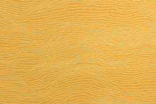 Load image into Gallery viewer, This screen printed fabric features a striae design in orange and yellow.  It can be used for several different statement projects including window accents (drapery, curtains and swags), toss pillows, bed skirts, light duty upholstery, handbags and duvet covers. It has a soft workable feel yet is stable and durable.  
