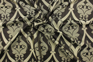 Aspire features a medallion style design in gold and blackish brown.  A slight sheen enhances the design.  This fabric offers beautiful design, style and color to any space in your home.  It has a soft workable feel and is perfect for window treatments (draperies, valances, curtains, and swags), bed skirts, duvet covers, pillow shams and accent pillows.  