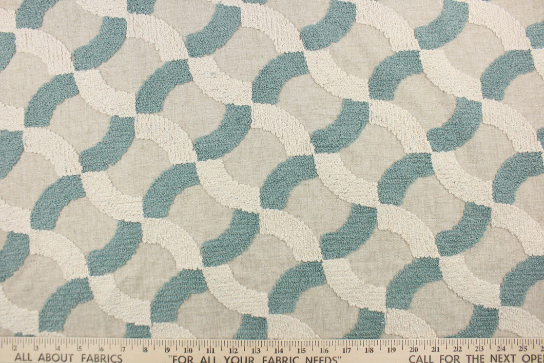 This fabric features an embossed lattice design in seafoam green and beige on an oatmeal colored background.  Use this for light upholstery, pillows, bedding and window treatments.  We offer Nash in other colors.