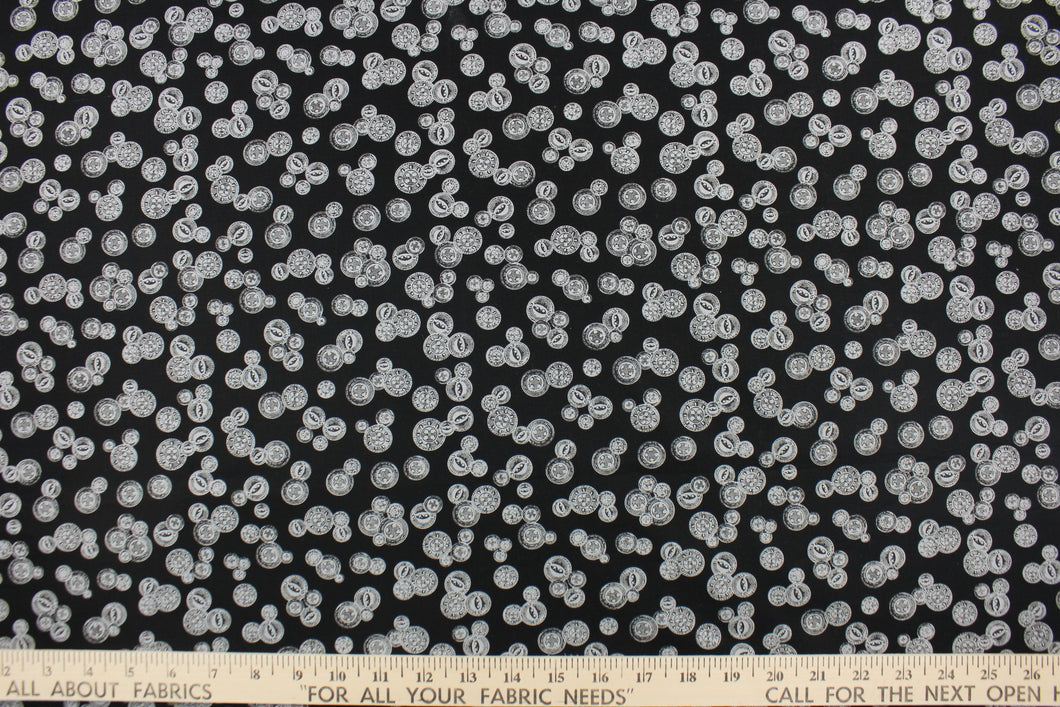 This elegant quilting print features vintage buttons in gray with outline/shading in different sizes set against a black background.  It can be used in all quilting designs, crafts, home décor.  Add a bit of vintage and uniqueness to any design. We offer this pattern in a few different colors. 