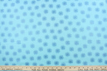Load image into Gallery viewer, This fabric features pearlescent metallic floating dandelions in peacock blue.  The light captures the pearl finish and the fabric appears to glow.  This versatile lightweight fabric is soft and easy to sew.  It would be great for quilting, crafting and sewing projects. 
