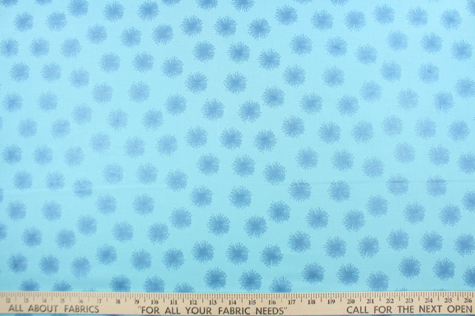 This fabric features pearlescent metallic floating dandelions in peacock blue.  The light captures the pearl finish and the fabric appears to glow.  This versatile lightweight fabric is soft and easy to sew.  It would be great for quilting, crafting and sewing projects. 