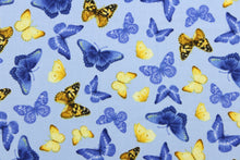 Load image into Gallery viewer, Feel the warmth of a sunny, summer day with these beautiful butterflies. This versatile lightweight fabric is soft and easy to sew.  It would be great for quilting, crafting and sewing projects.  Colors include shades of blue, yellow, brown and black.
