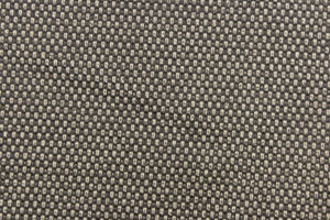  This vinyl fabric features a weave design in brown, taupe and gray tones.
