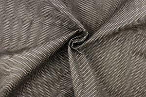  This vinyl fabric features a weave design in brown, taupe and gray tones.