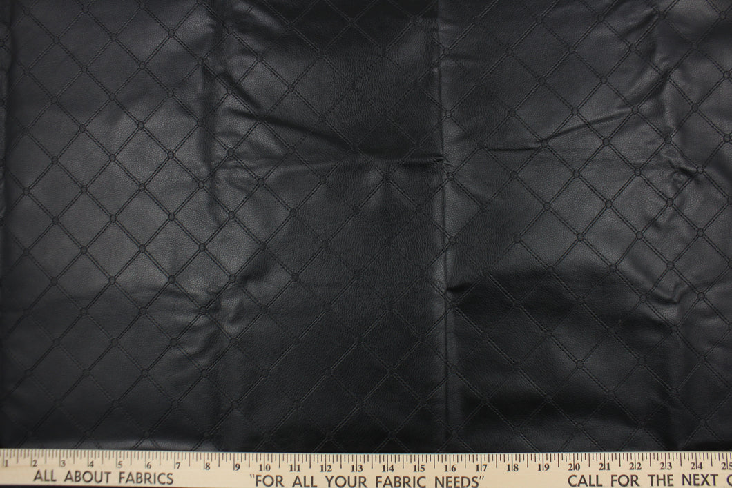 This vinyl fabric features a diamond design in black .