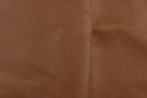 This vinyl fabric features a slight crackle design in rich brown tone.