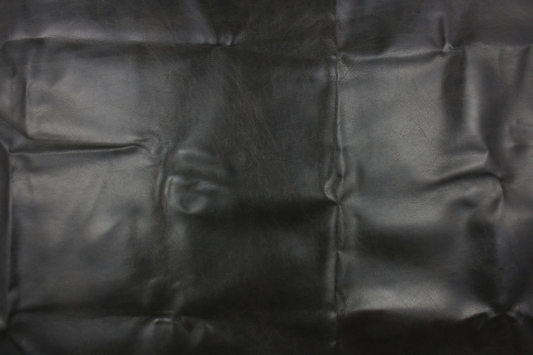 This vinyl fabric features a slight crackle design in black.