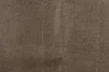 Load image into Gallery viewer, This upholstery weight faux leather fabric in a rich brown has a soft flannel backing and can be used for upholstery projects, picture frames, pillows, headboards craft projects, purses, fashion accessories and more! 
