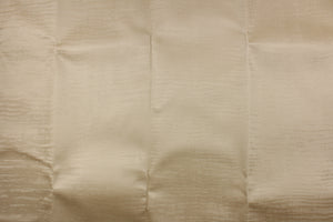 This vinyl fabric features a smooth velvet look  in beige .