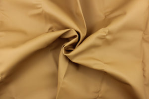 This vinyl fabric features a smooth design in golden tan . 