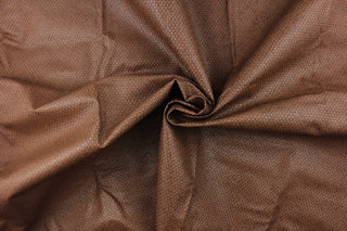 This vinyl fabric features a weave design in a rich brown tone. 