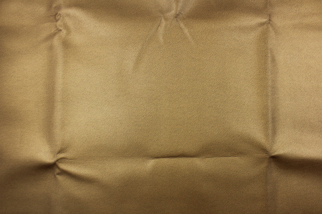 This vinyl fabric features a smooth  design in bronze tone.