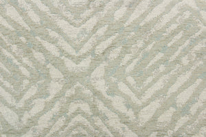 This fabric features a geometric design in pale green, with hints of blue and gray.
