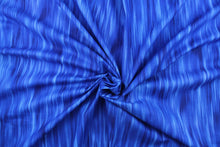 Load image into Gallery viewer, This fabric features stripes in varying shades of blue that blend together to create a beautiful color palette.  It has a nice soft hand and would be great for quilting, crafting and home decor.  We offer this pattern in several different colors.

