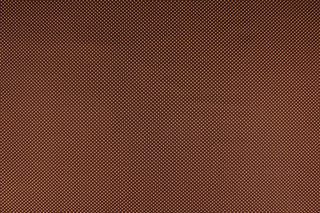 This fabric features small orange polka dots on a brown background.  The versatile lightweight fabric is soft and easy to sew.  It would be great for quilting, crafting and sewing projects.  