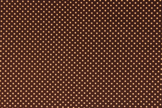This fabric features small orange polka dots on a brown background.  The versatile lightweight fabric is soft and easy to sew.  It would be great for quilting, crafting and sewing projects.  