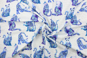 From the "Cat-i-tude" series, this fabric features fancy, multicolored, patterned cats outlined in metallic silver on a white background with grey squares.  The versatile lightweight fabric is soft and easy to sew.  It would be great for quilting, crafting and sewing projects.  Colors include purple, teal, blue, green and white.