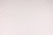 Load image into Gallery viewer, This fabric features pink polka dots on a white background.  The versatile lightweight fabric is soft and easy to sew.  It would be great for quilting, crafting and sewing projects.  
