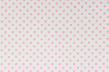 Load image into Gallery viewer, This fabric features pink polka dots on a white background.  The versatile lightweight fabric is soft and easy to sew.  It would be great for quilting, crafting and sewing projects.  

