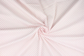 This fabric features pink polka dots on a white background.  The versatile lightweight fabric is soft and easy to sew.  It would be great for quilting, crafting and sewing projects.  
