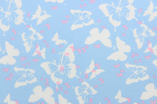 Load image into Gallery viewer, Think of a warm, sunny, summer day with this fabric featuring large and small butterflies in pink and white on a baby blue background.  The versatile lightweight fabric is soft and easy to sew.  It would be great for quilting, crafting and sewing projects.  
