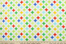 Load image into Gallery viewer, This fabric features large medallions in varying shades of green, blue, yellow and red on a white background.  The versatile lightweight fabric is soft and easy to sew.  It would be great for quilting, crafting and sewing projects.  

