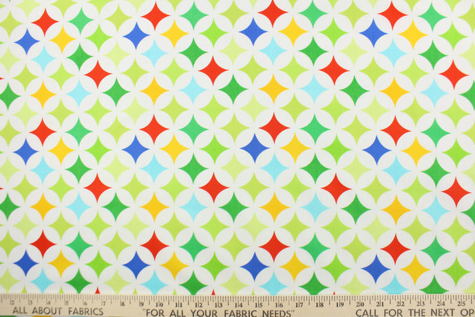This fabric features large medallions in varying shades of green, blue, yellow and red on a white background.  The versatile lightweight fabric is soft and easy to sew.  It would be great for quilting, crafting and sewing projects.  
