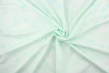 Load image into Gallery viewer, This fabric features ferns with a distressed look that enhances the design.  Colors included are various shades of light blue/green with hints of white.  It has a nice soft hand and would be great for quilting, crafting and home decor.  We offer this fabric in several different colors.
