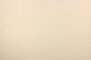 This fabric features pink polka dots on a cream background.  The versatile lightweight fabric is soft and easy to sew.  It would be great for quilting, crafting and sewing projects.  