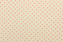 Load image into Gallery viewer, This fabric features pink polka dots on a cream background.  The versatile lightweight fabric is soft and easy to sew.  It would be great for quilting, crafting and sewing projects.  
