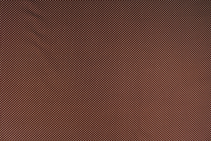This fabric features small white polka dots on a brown background.  The versatile lightweight fabric is soft and easy to sew.  It would be great for quilting, crafting and sewing projects.  