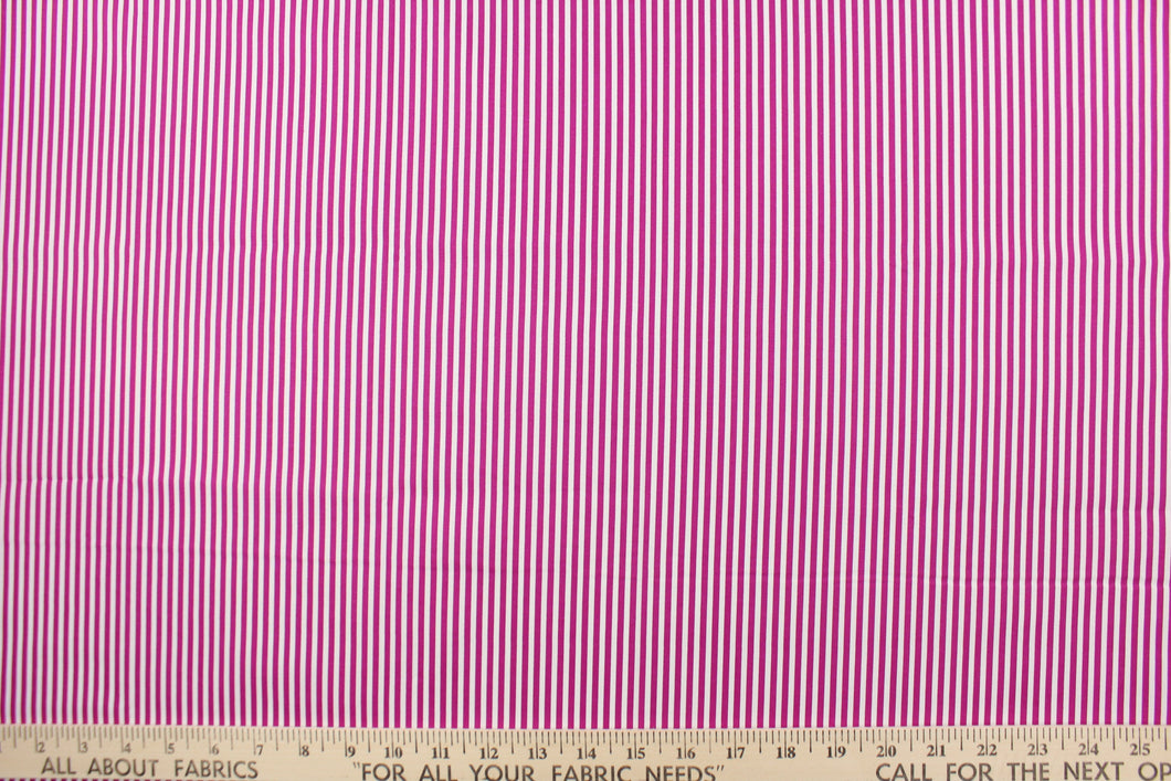 This fabric features stripes in fuchsia and white.  The versatile lightweight fabric is soft and easy to sew.  It would be great for quilting, crafting and sewing projects.  