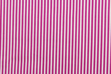 Load image into Gallery viewer, This fabric features stripes in fuchsia and white.  The versatile lightweight fabric is soft and easy to sew.  It would be great for quilting, crafting and sewing projects.  
